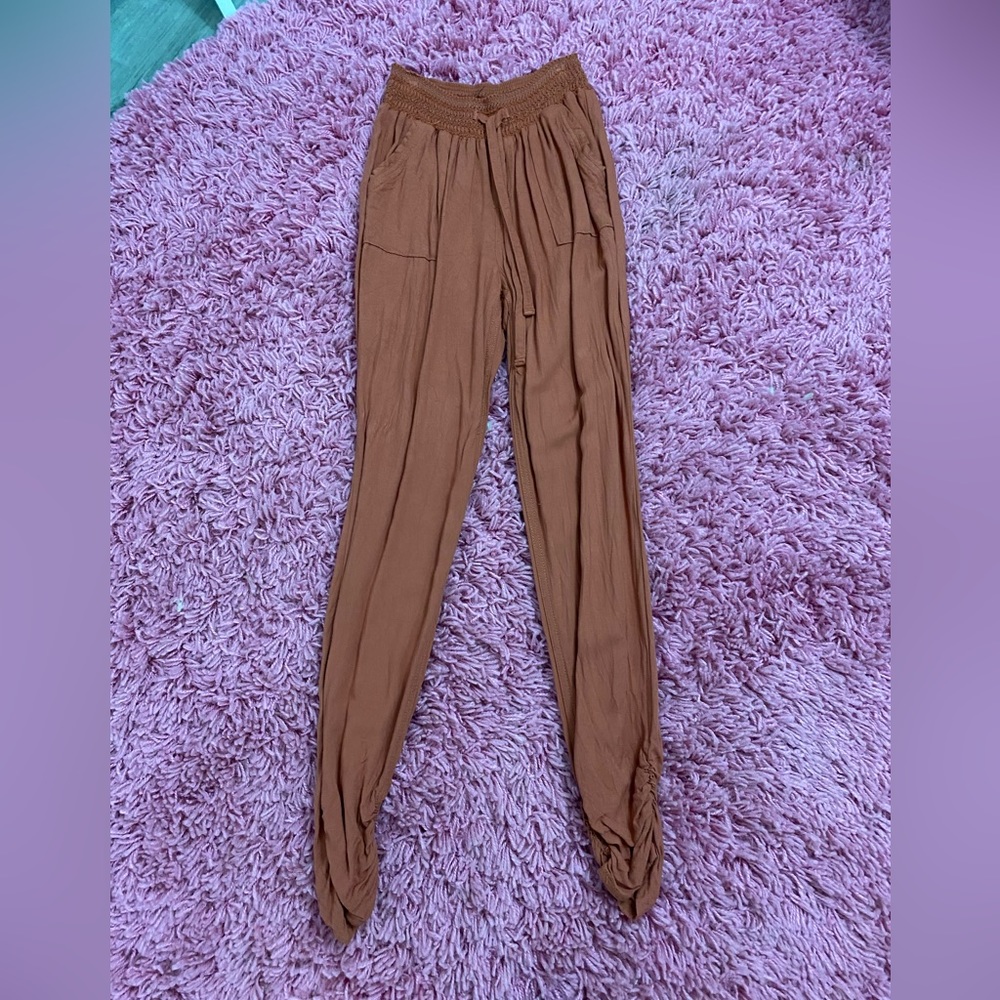 Rust colored joggers with ruched bottom
